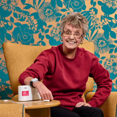 Image showing a Care Link customer wearing her alarm bracelet.